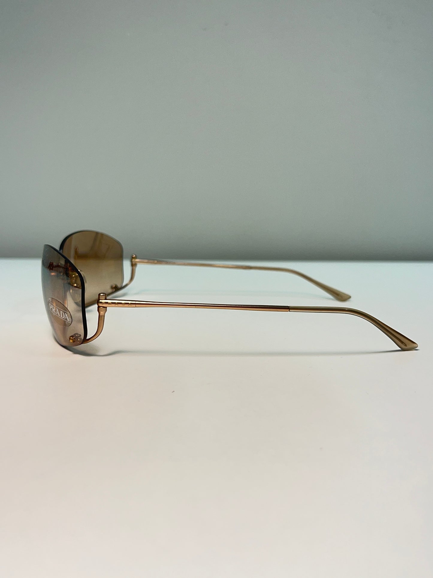 PRADA inverted rose-gold sunglasses