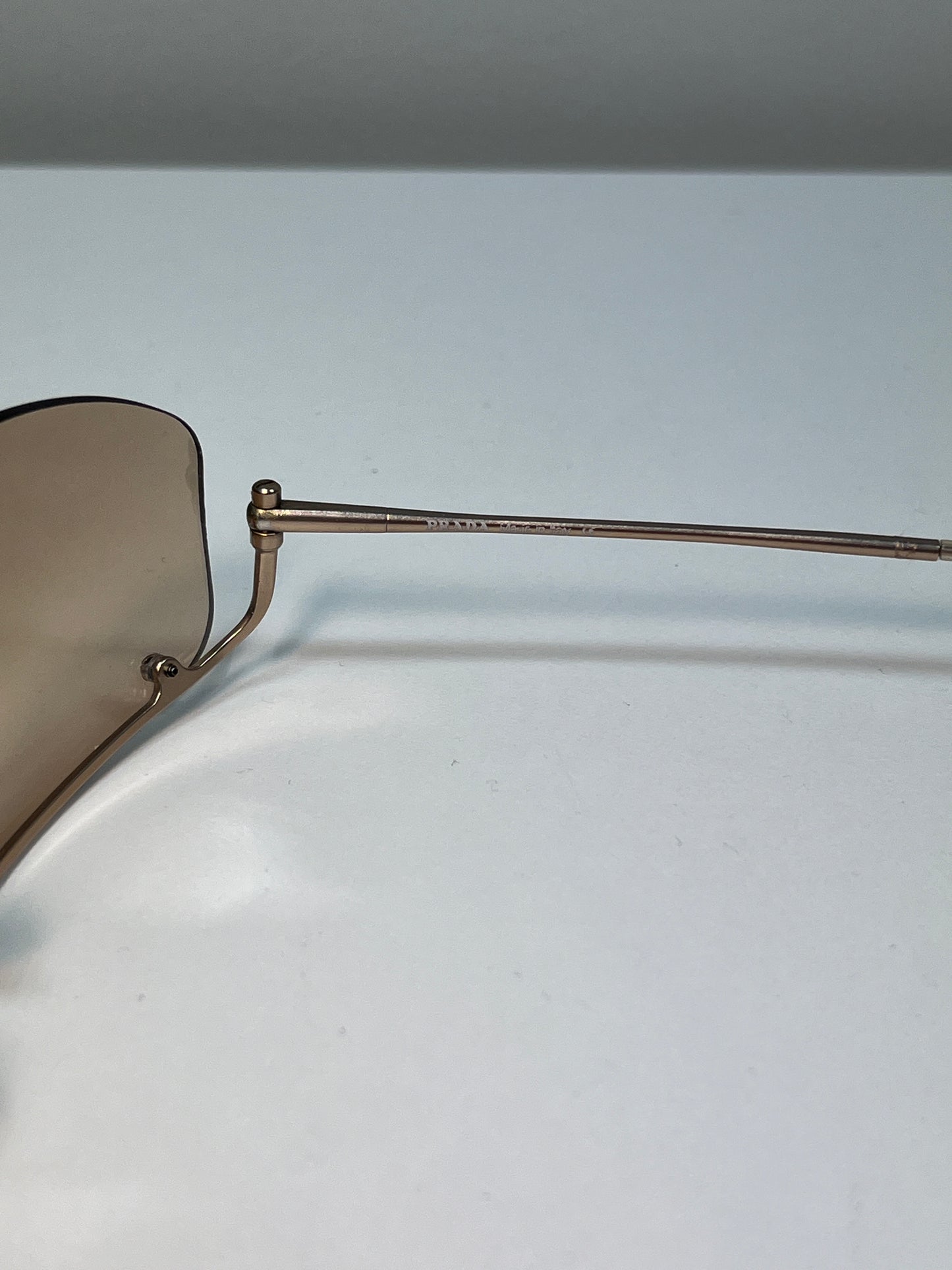 PRADA inverted rose-gold sunglasses