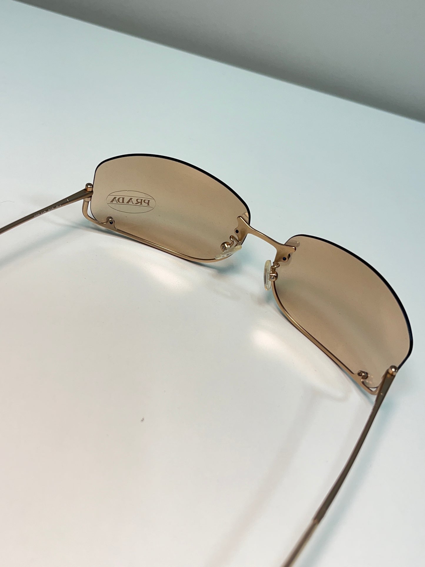 PRADA inverted rose-gold sunglasses