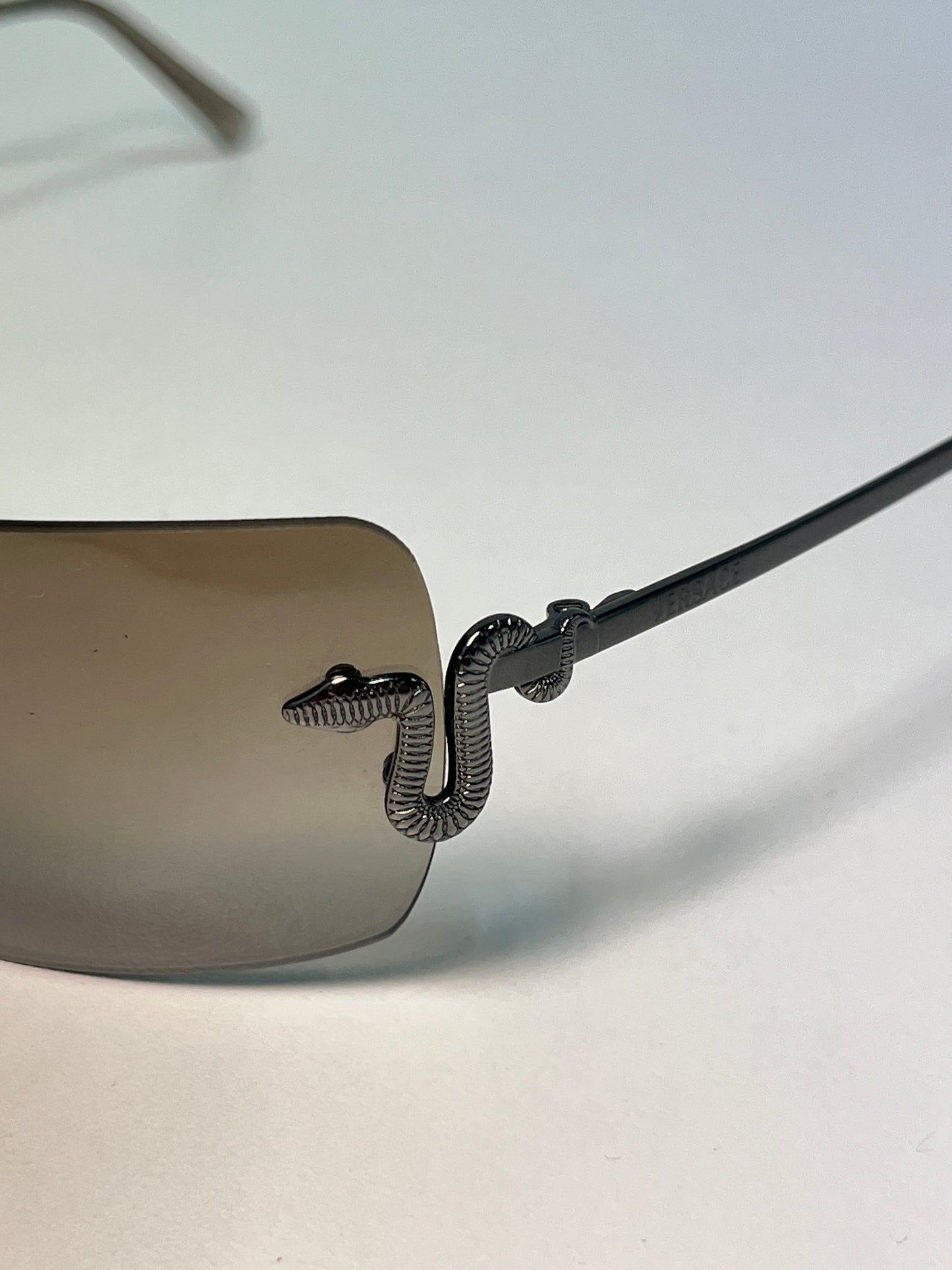 VERSACE black retro frameless squared snake embellishment sunglasses