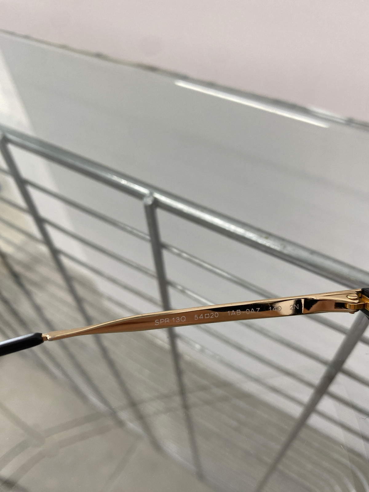 Prada black and gold sunglasses