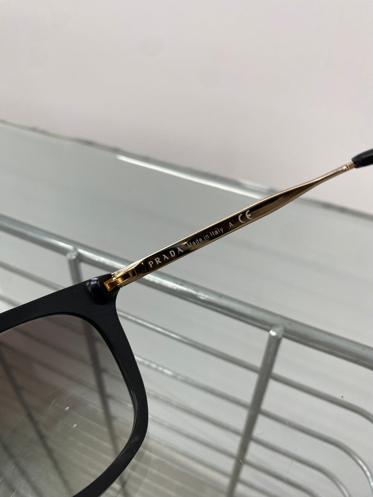 Prada black and gold sunglasses