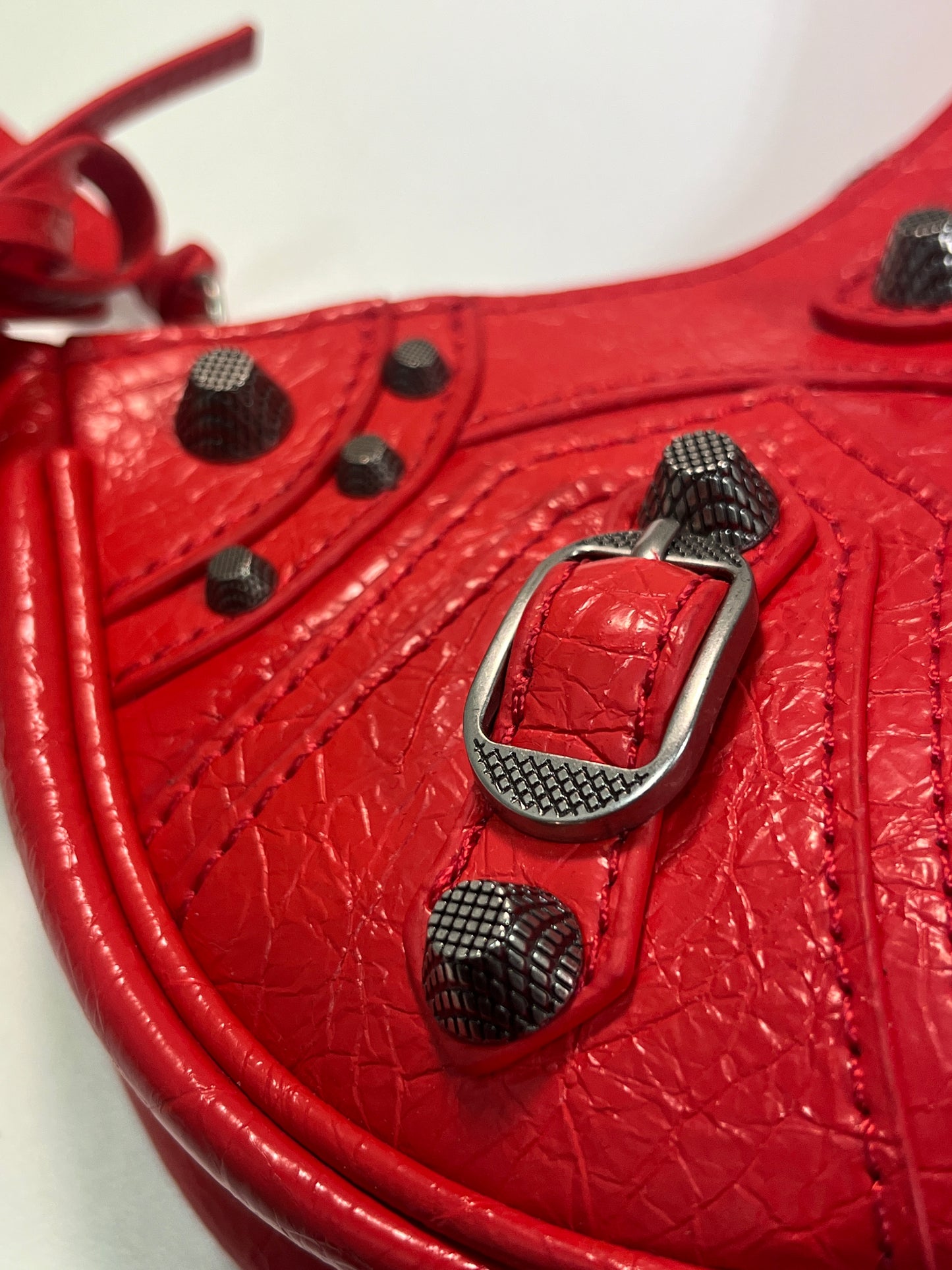 BALENCIAGA Le Cagole mini red leather studded bag