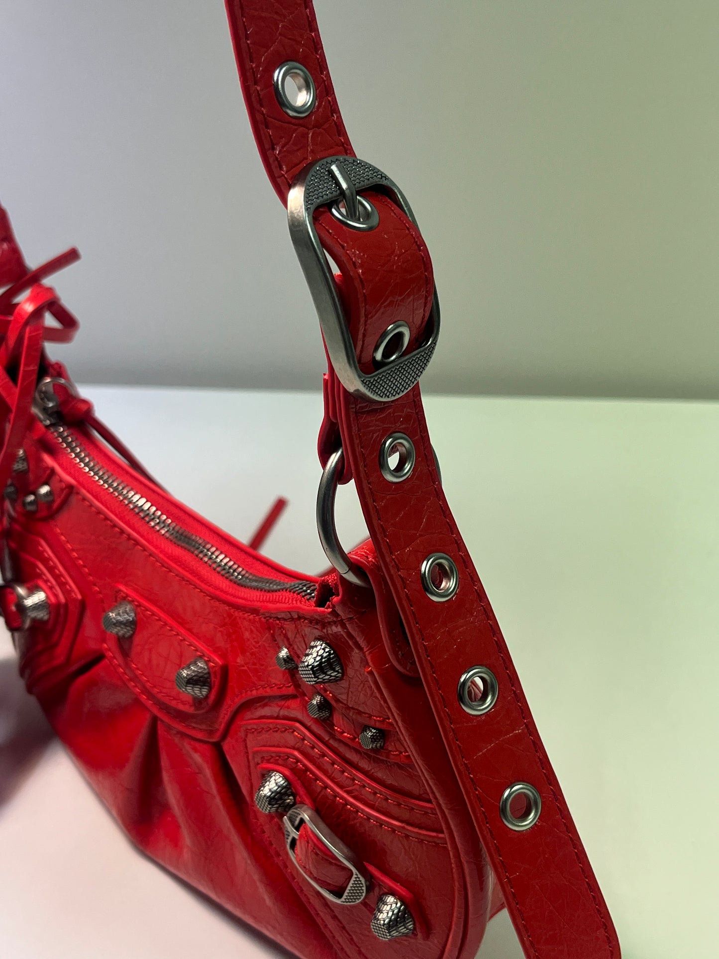 BALENCIAGA Le Cagole mini red leather studded bag